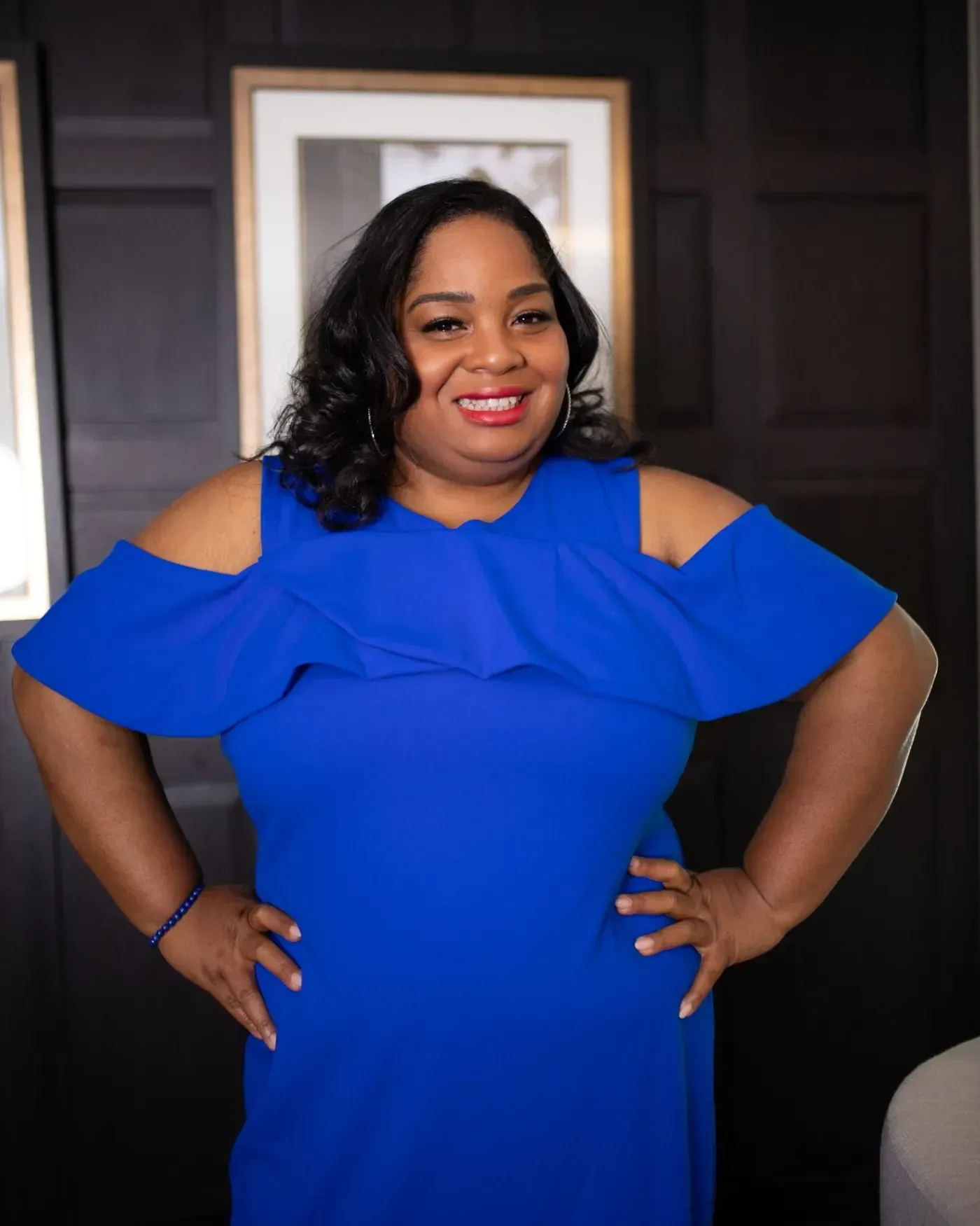 Amber Aziza in a blue dress
